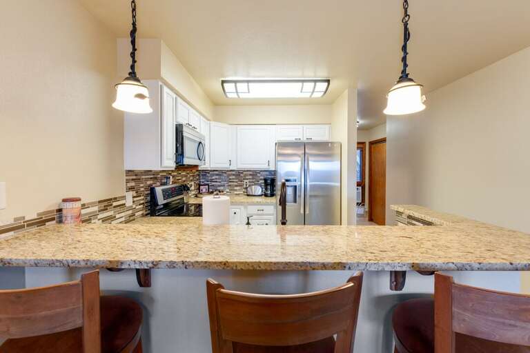 Additional seating at the island. | Main Level