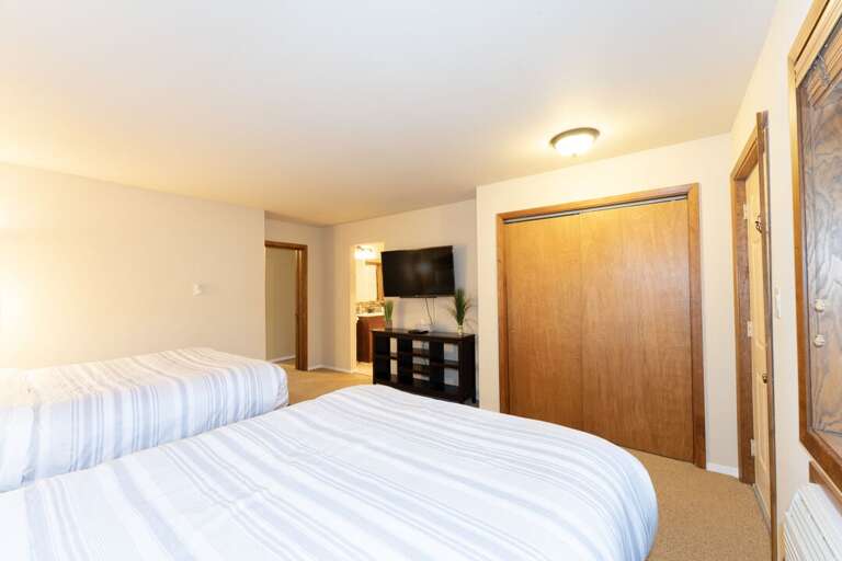 Large closet and TV. | Main Level