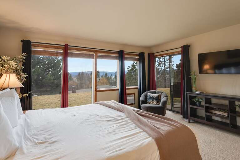 Primary bedroom with large windows for plenty of Montana lighting. | Main Level
