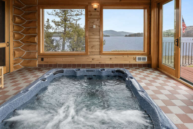 Enjoy your large indoor private hot tub with stunning lake views. | Interior