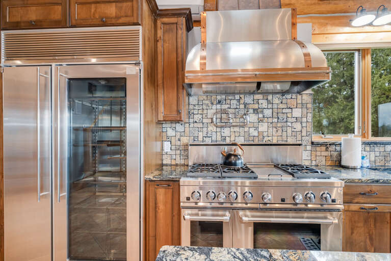 Large fridge and cooking area, great for hosting. | Interior