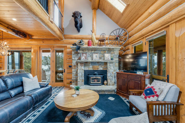 The main living area includes a TV and a fireplace. | Interior