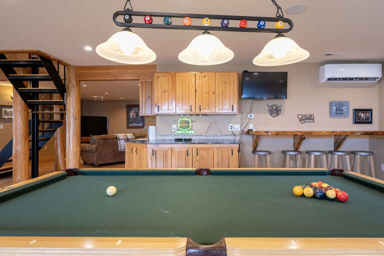 Pool table and bar seating | Lower Level