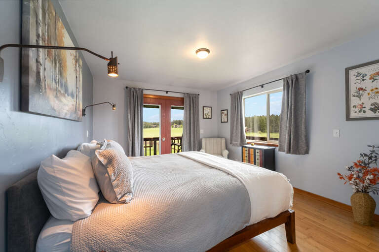 Beautiful views and access to deck from primary bedroom | Interior