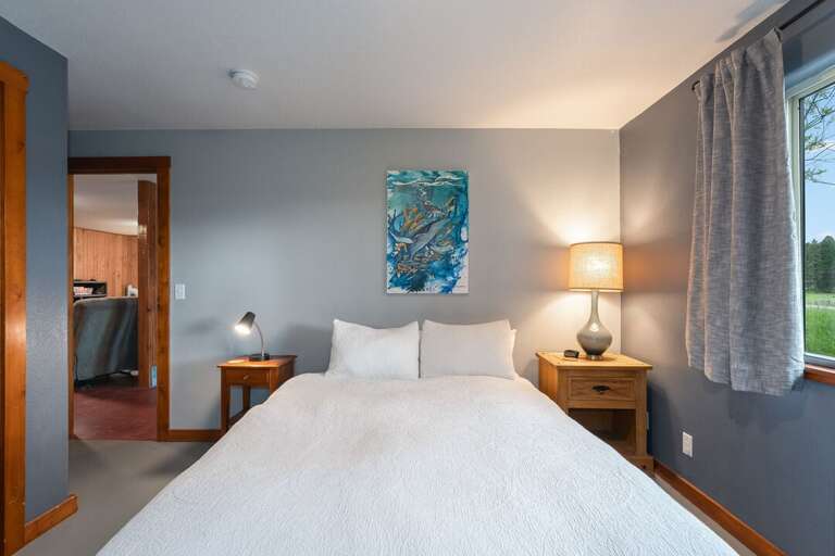 Downstairs bedroom with queen bed | Interior