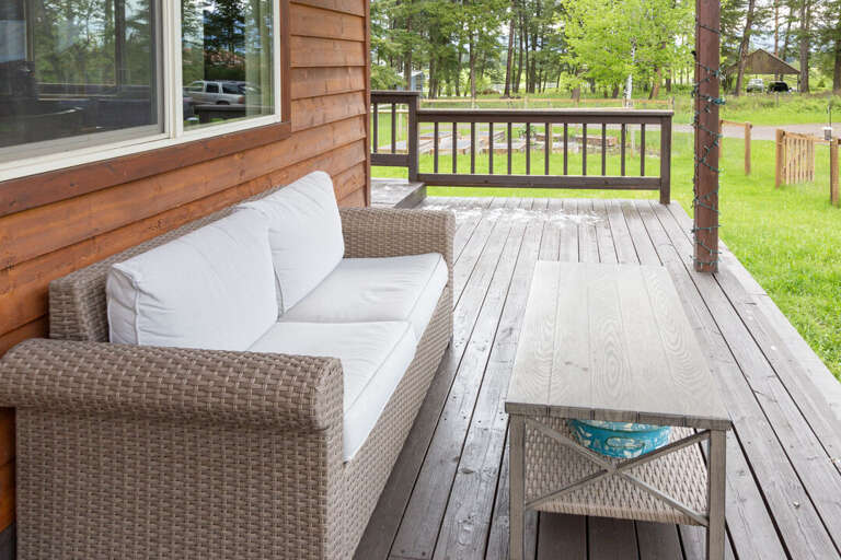 Lounge seating for two with coffee table on the porch | Exterior