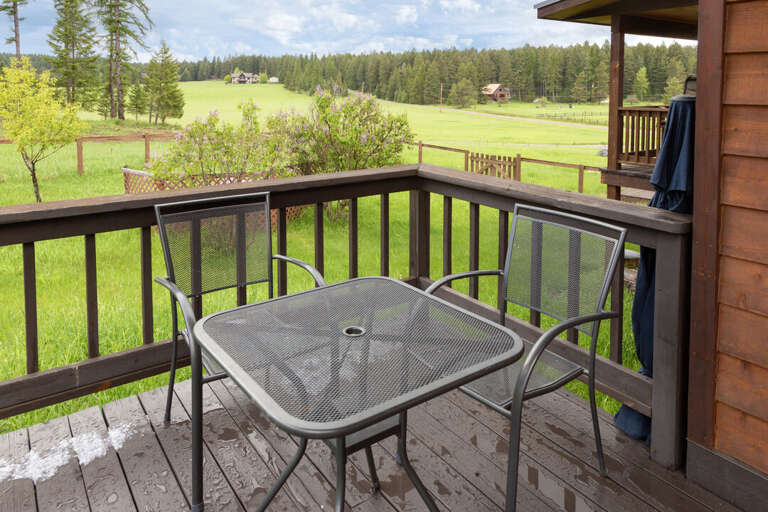 Table seating for two on porch | Exterior