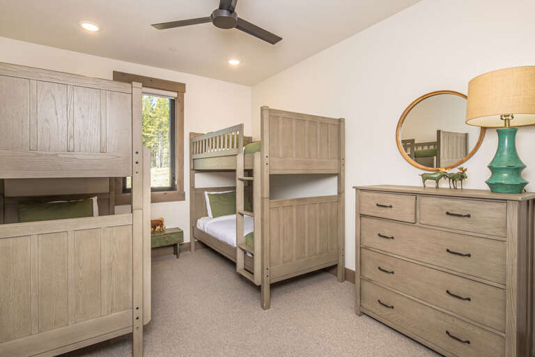 Cozy bunk bed with textured bedding and pillows | Main Level