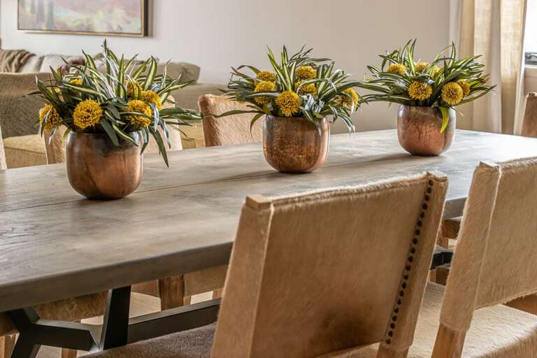 Large wooden dining table with seating I Main Level