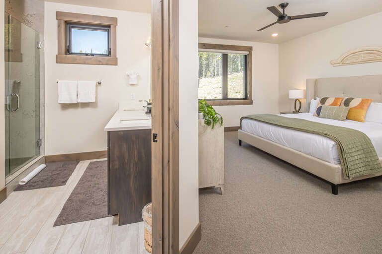 Master bedroom with attached bathroom and vanity | Main Level