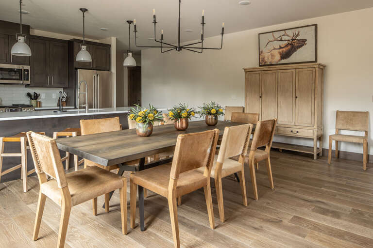Open concept dining with large table and kitchen