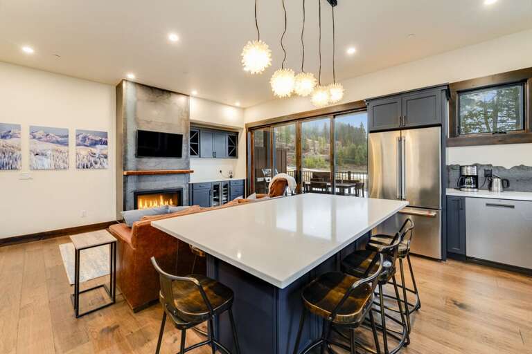 Gather around the island to enjoy your favorite meal. | Main Level