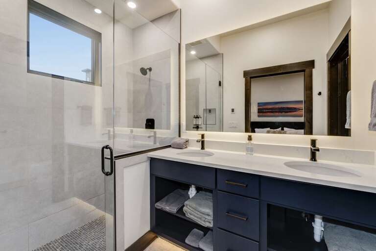 Walk-in shower and dual vanity. | Main Level