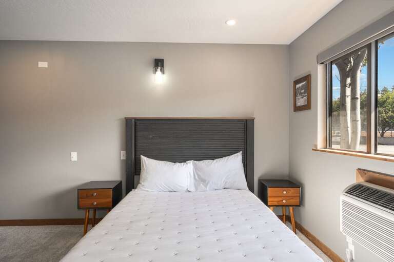 Queen sized bed. | Main Level