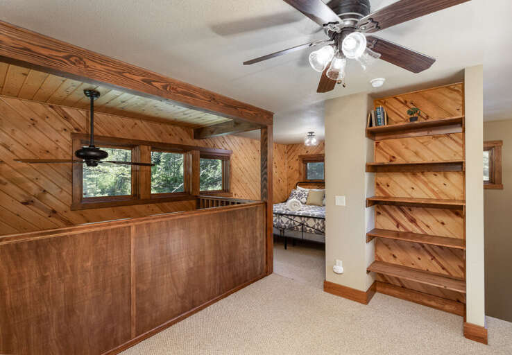 Loft area upstairs with Queen bed and ceiling fan | Upper Level