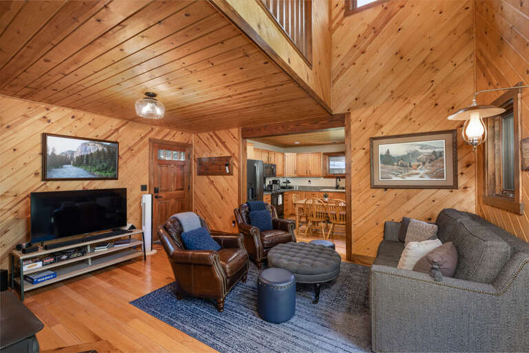 Log cabin escape with ample seating in the living room | Lower Level