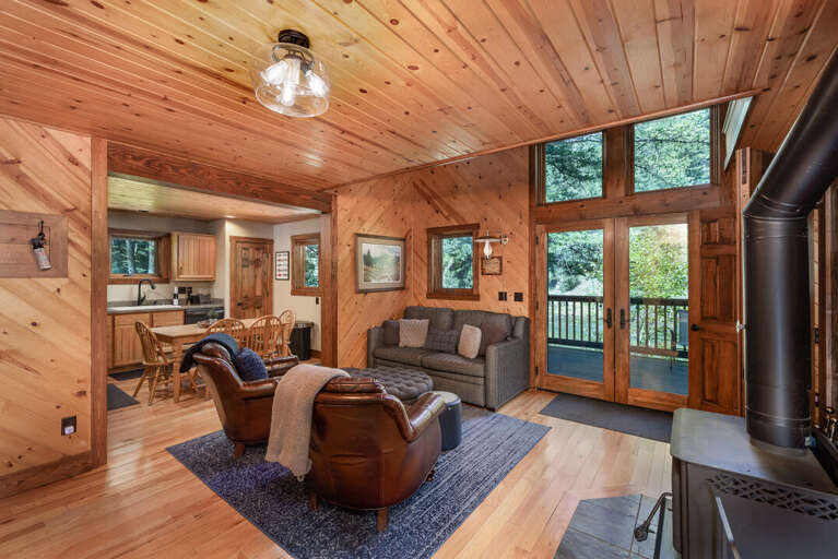 Open the back doors and listing to the rushing water while sitting in the living room | Lower Level