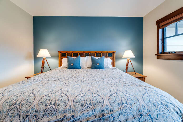 Primary bedroom with king bed. | Main Level