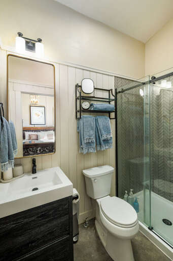 Modern bathroom with sleek glass shower I Main Level