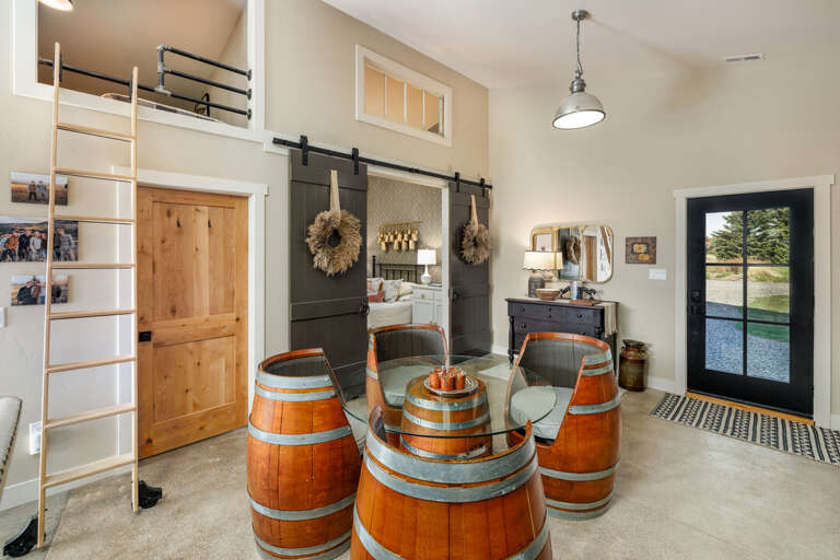 Rustic dining area with unique barrel table I Main Level