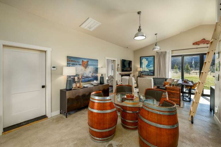 Stylish dining nook featuring handcrafted barrel table I Main Level