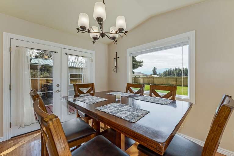 Dining room with french doors to the backyard. | Glacier Ridge House