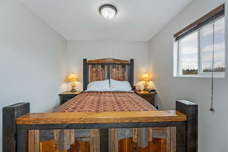 Queen size bed. | Main Level