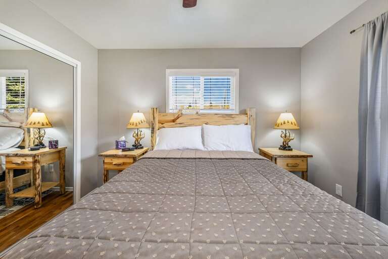 Queen size bed. | Main Level