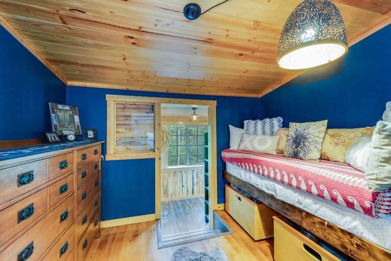 Twin size bed with dressers. | Main Level