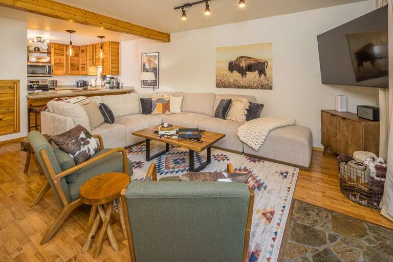 Ample seating in the living room for everyone to wind down at the end of the day | Main Level
