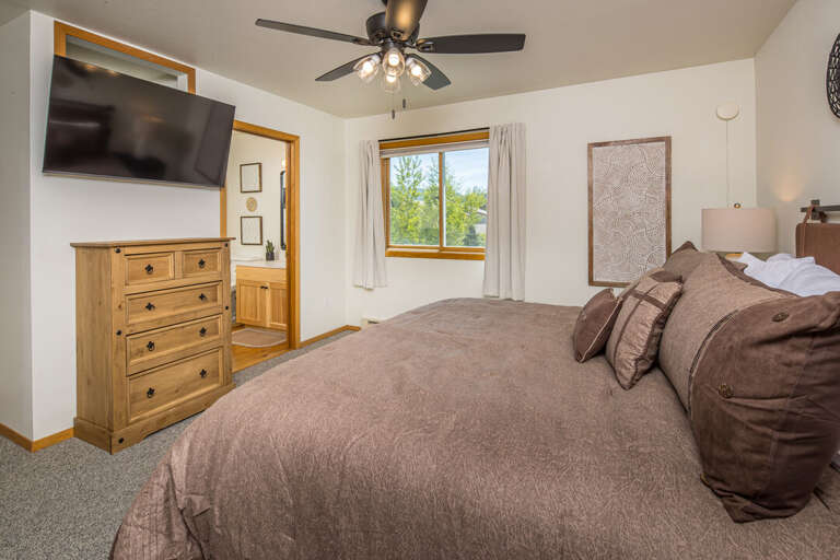 Ensuite bathroom and TV providing the ultimate retreat | Upper Level