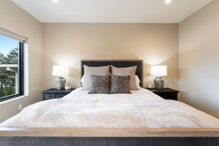King size bed in primary bedroom upstairs | Interior