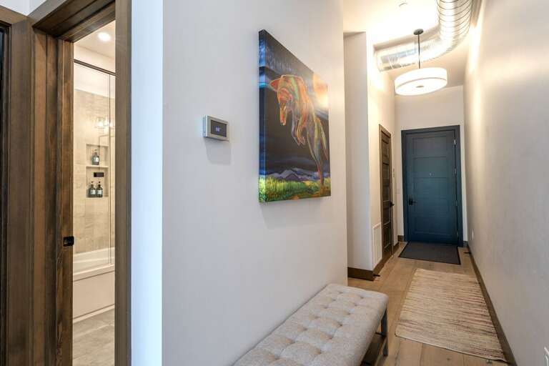 Entry hallway with access to bedrooms and bathrooms | Interior