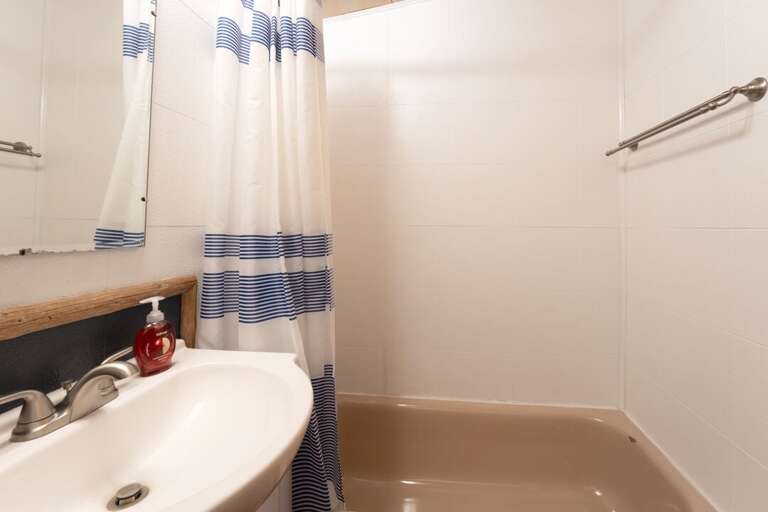 Enjoy a soak in the tub or a shower after a long day on the lake I Lower Level