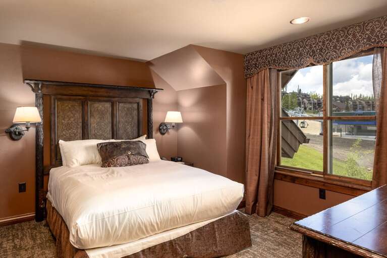 Cozy queen bed in secondary bedroom | Main Level