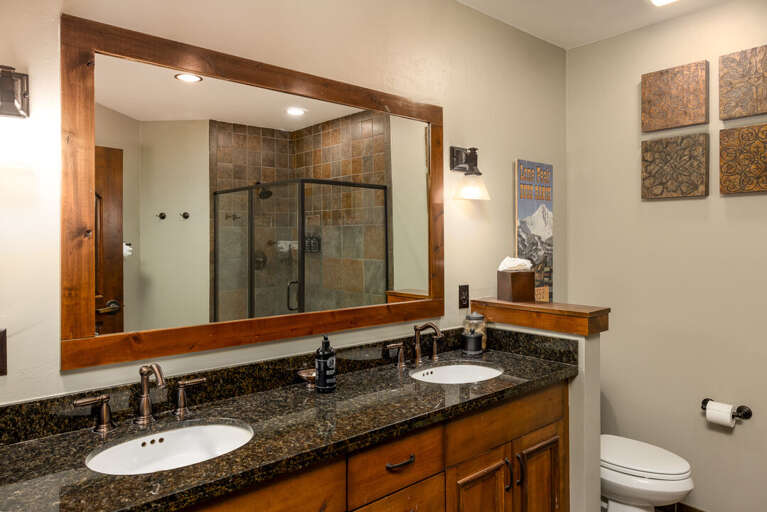Dual vanity with walk-in shower in the primary bedroom | Main Level