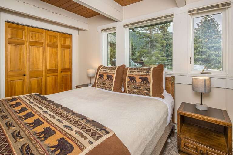 Cozy mountain bedroom with forest views | Main Level