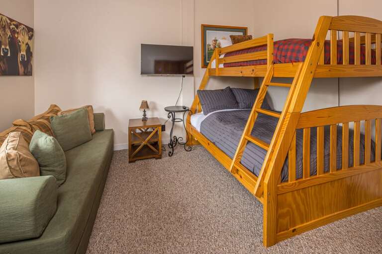 Queen over Full Bunk beds with seating to watch TV | Main Level