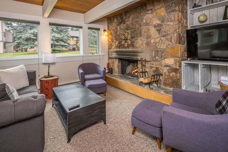 Seating with outside view and fireplace | Main Level