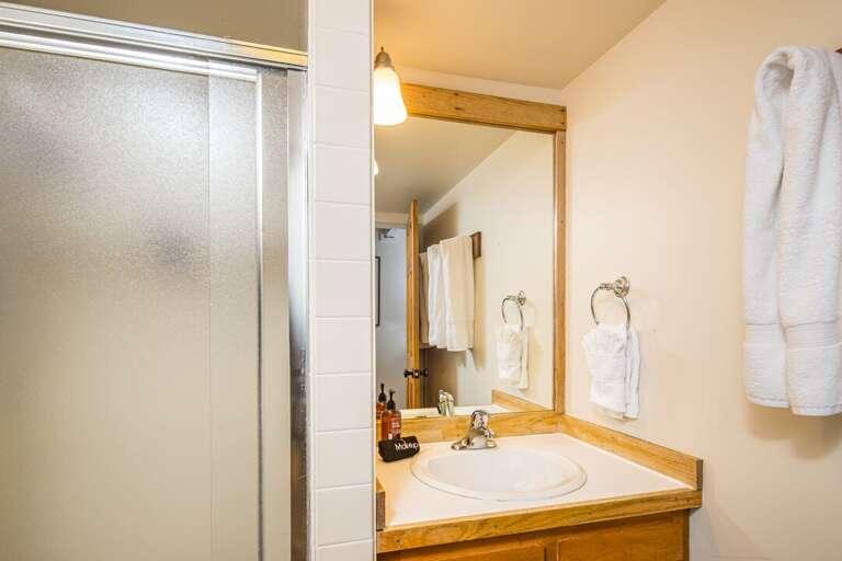 Single Vanity with glass shower door | Main Level