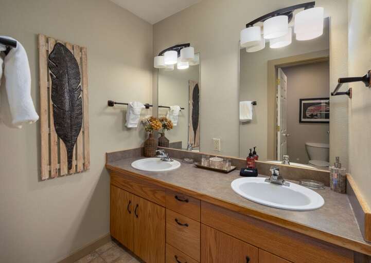 Dual vanity in ensuite primary bathroom | Upper Level