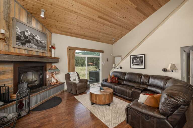 Sit by the fireplace and enjoy the views | Main Level