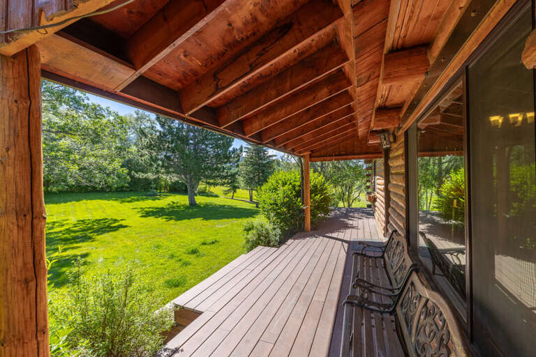 Covered deck with easy access to the backyard | Exterior