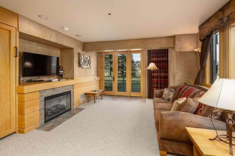 Cozy up in front of the fireplace to warm up after a day of ultimate ski runs | Main Level