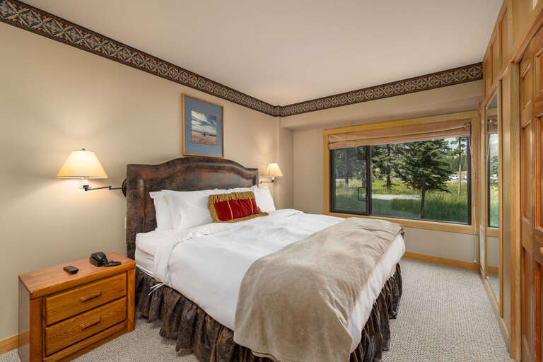 King bedroom in primary suite, offering a private escape | Main Level