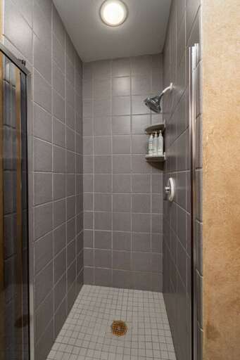 Walk-in shower in the shared bathroom | Main Level