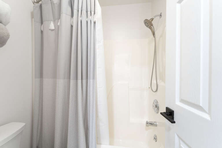 A clean, updated shower ready to rinse off the day I Upper Level