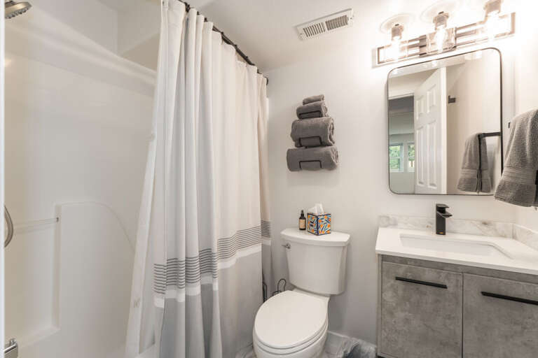 A crisp, no-fuss bathroom tucked downstairs I Lower Level