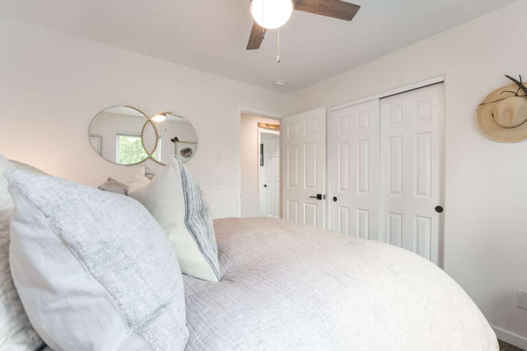 A peaceful bedroom retreat, ready for a good night's sleep with closet space I Upper Level