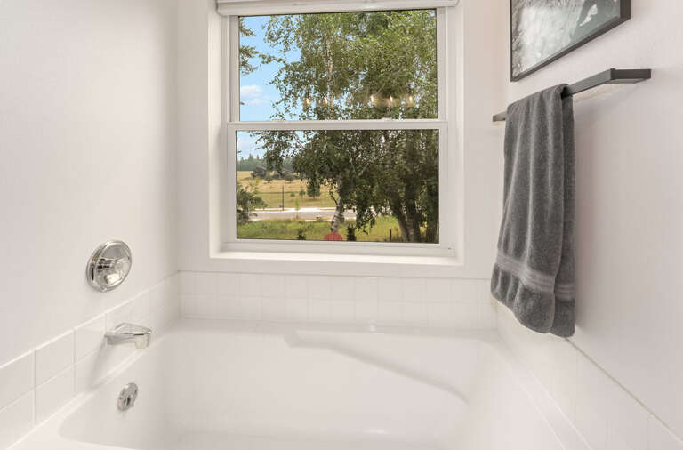 Soak in the tub with a view straight out to the field I Upper Level